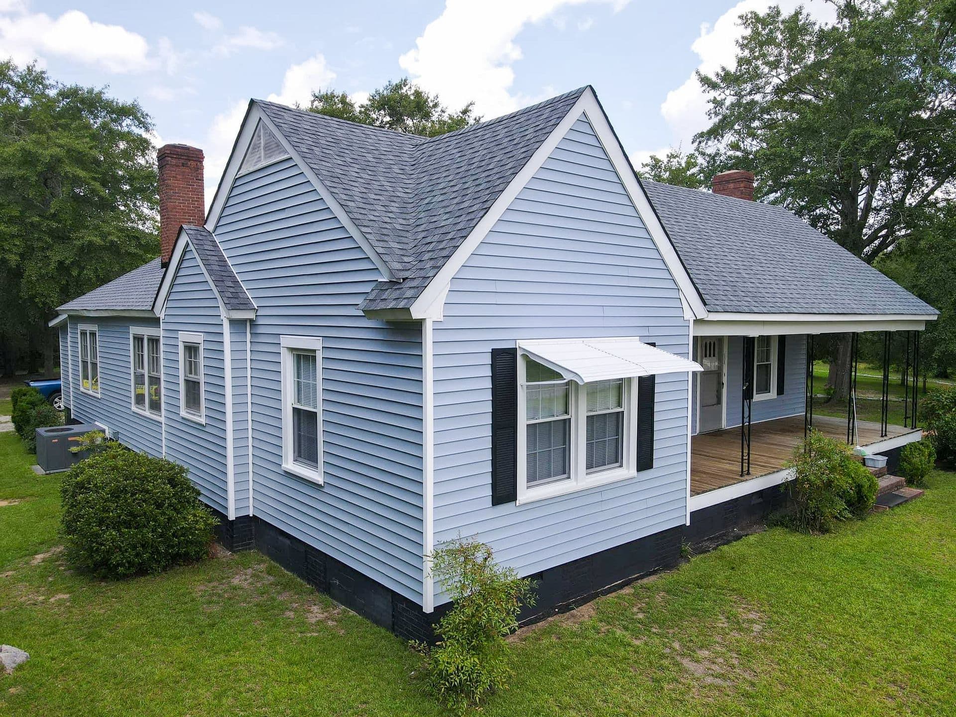 A house with new light blue siding.